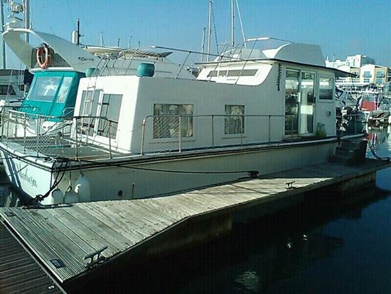 The Houseboat Medusa, 39ft, as moored at Denton Island, Newhaven,